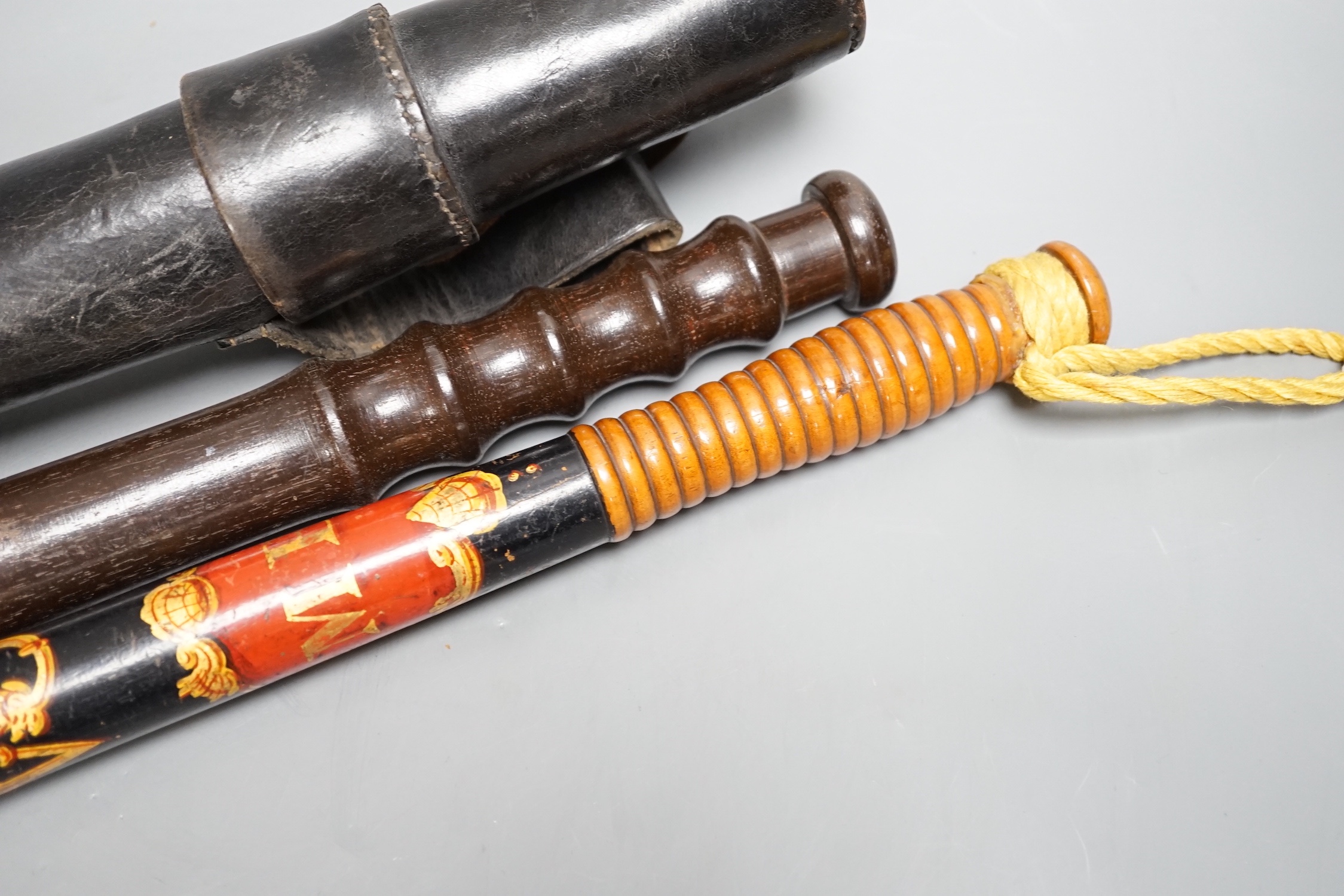 A Victorian painted wood ceremonial truncheon, 44cm and one other truncheon in leather case